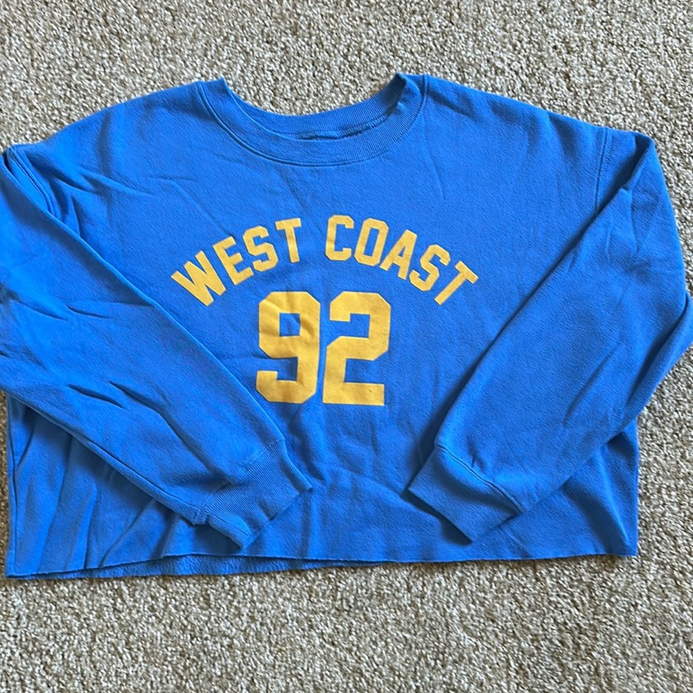 Blue cropped sweatshirt.